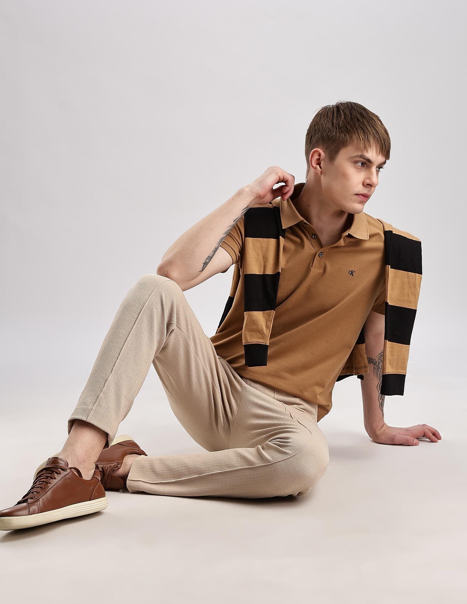Calvin Klein Jeans Mens Brown Solid Polo Shirts