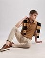 Calvin Klein Jeans Mens Brown Solid Polo Shirts